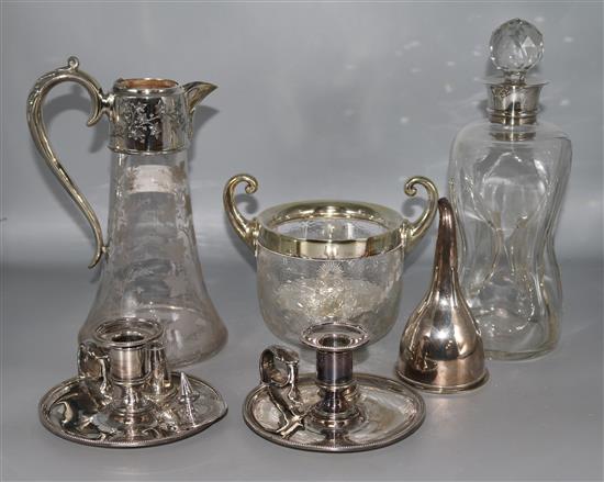 A silver mounted waisted glass decanter, a pair of plated chambersticks, wine funnel & two other items.